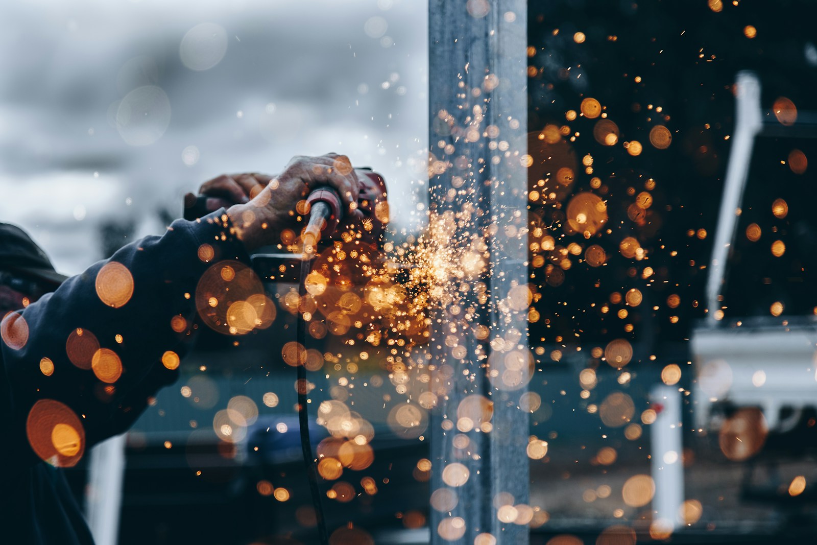person holding tool during daytime construction technology