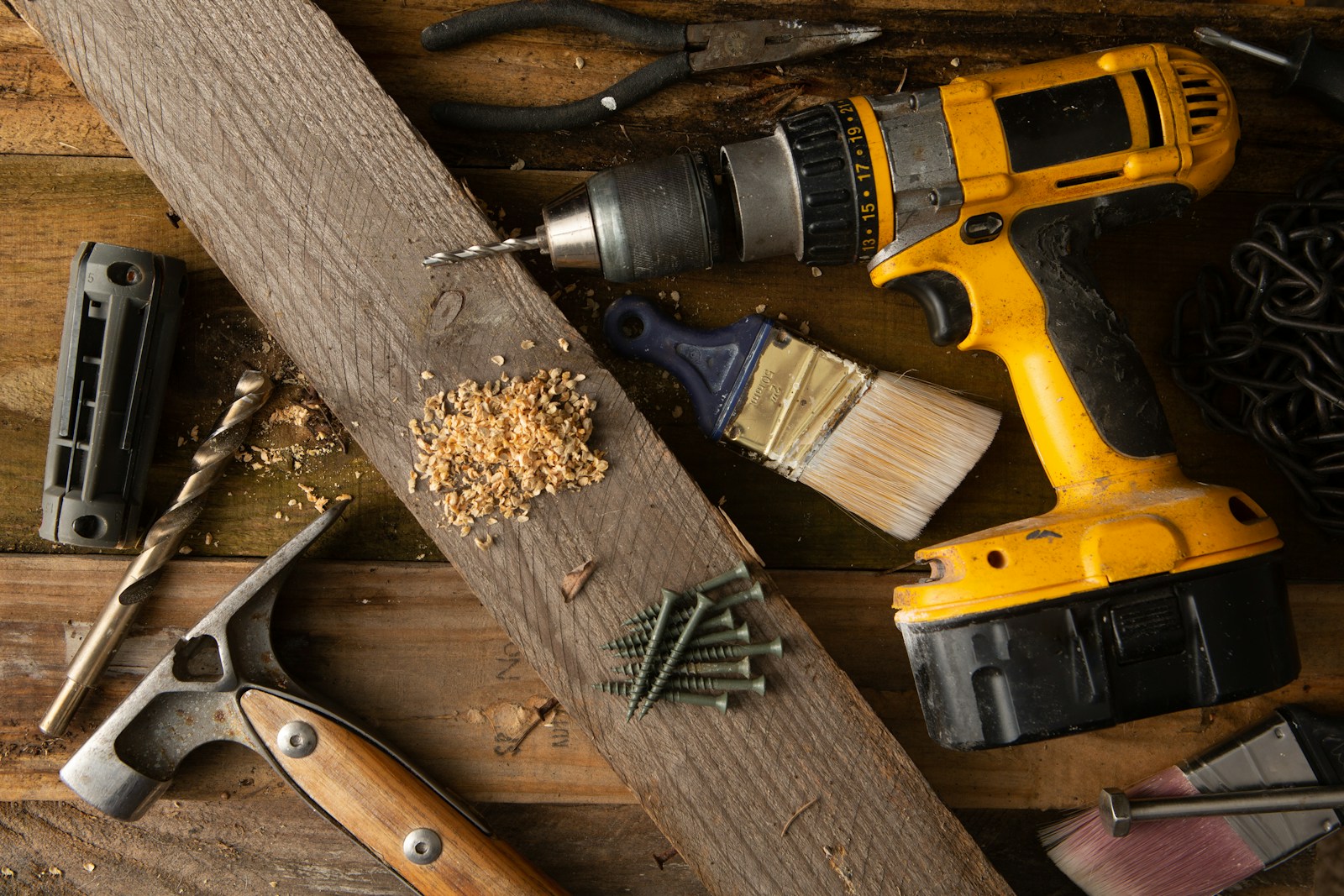 a couple of tools that are sitting on a table Renovation Contractor vs New Build Contractor