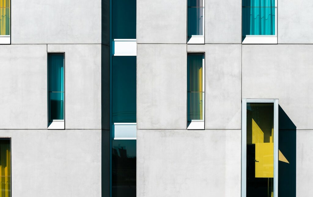 a building with multiple windows and a yellow door