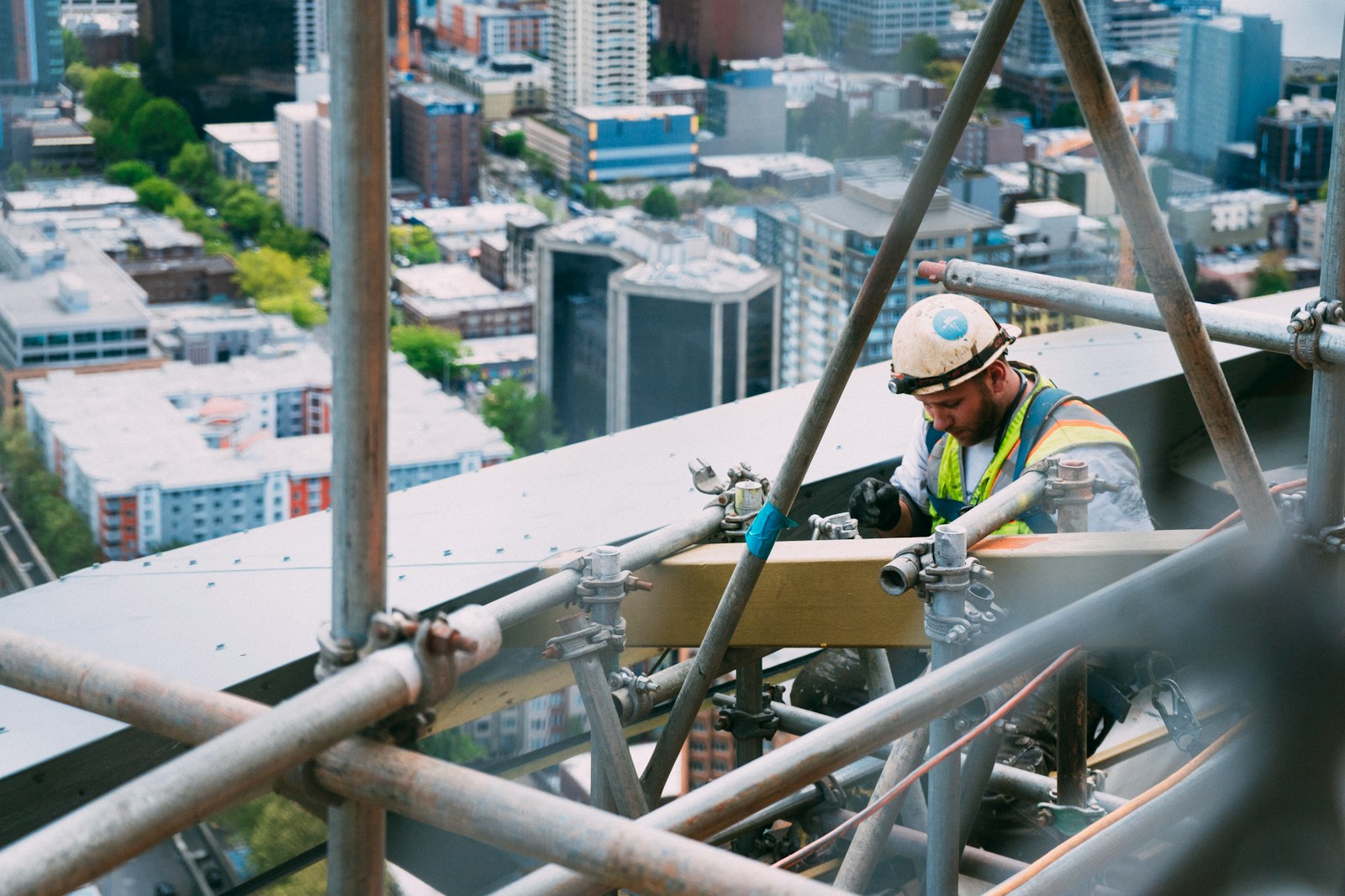 man doing welding on outdoors (Project Management Construction): Best Practices for Commercial Projects
