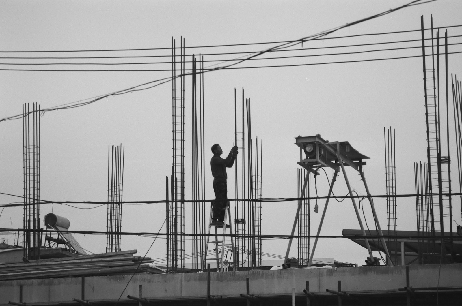 a man standing on top of a building under construction The Range of (construction jobs) We Handle in Senior Living, Healthcare, and Education Projects