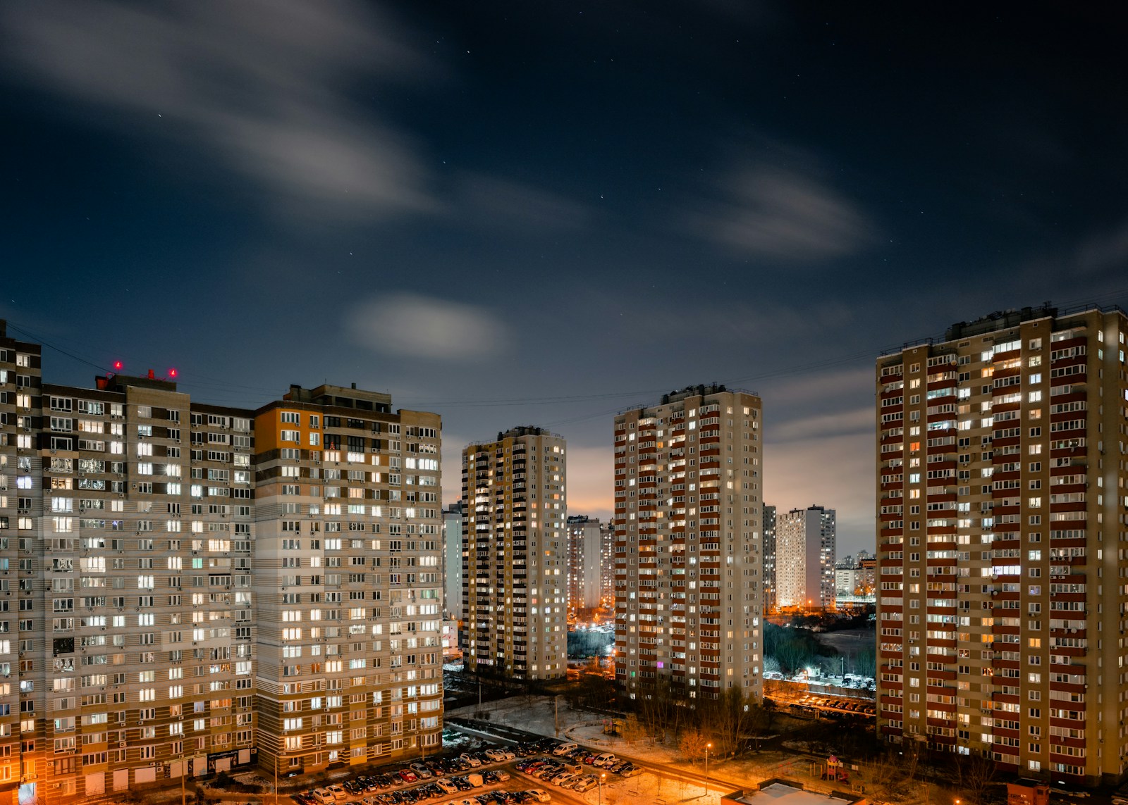 Photo by Eugene Chystiakov city skyline during night time Renovation Contractors