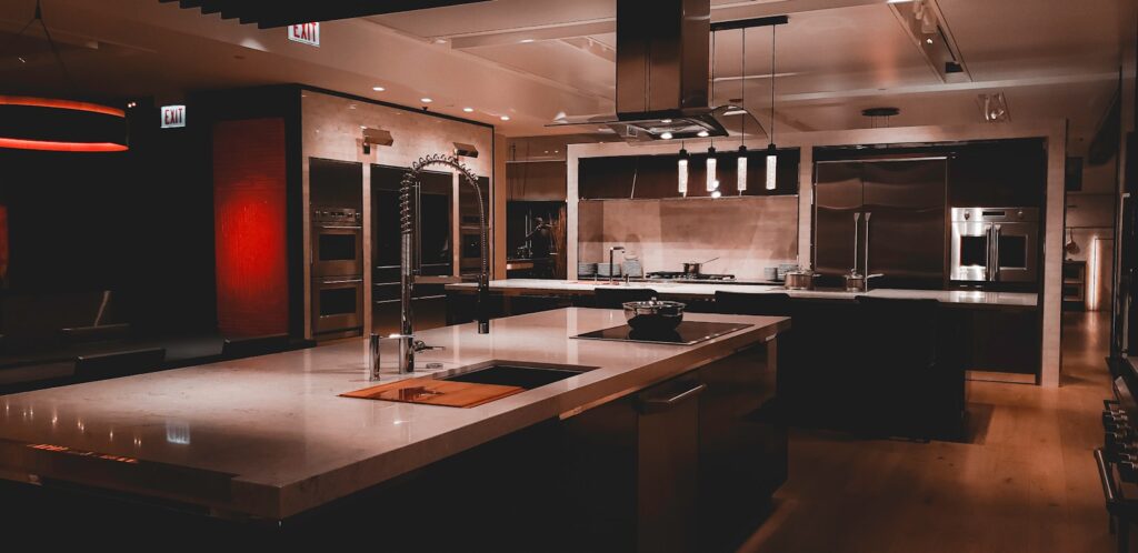 A large kitchen with a center island and stainless steel appliances