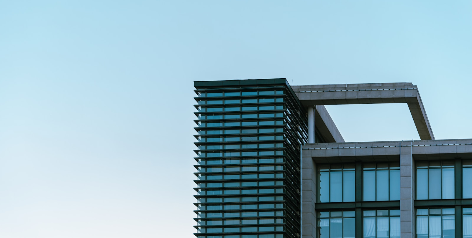 a very tall building with a sky in the background Commercial Architecture