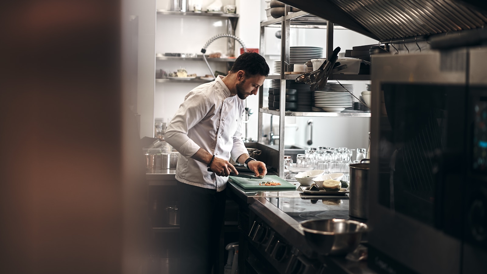 man in white dress shirt holding white ceramic plate Kitchen Remodeling