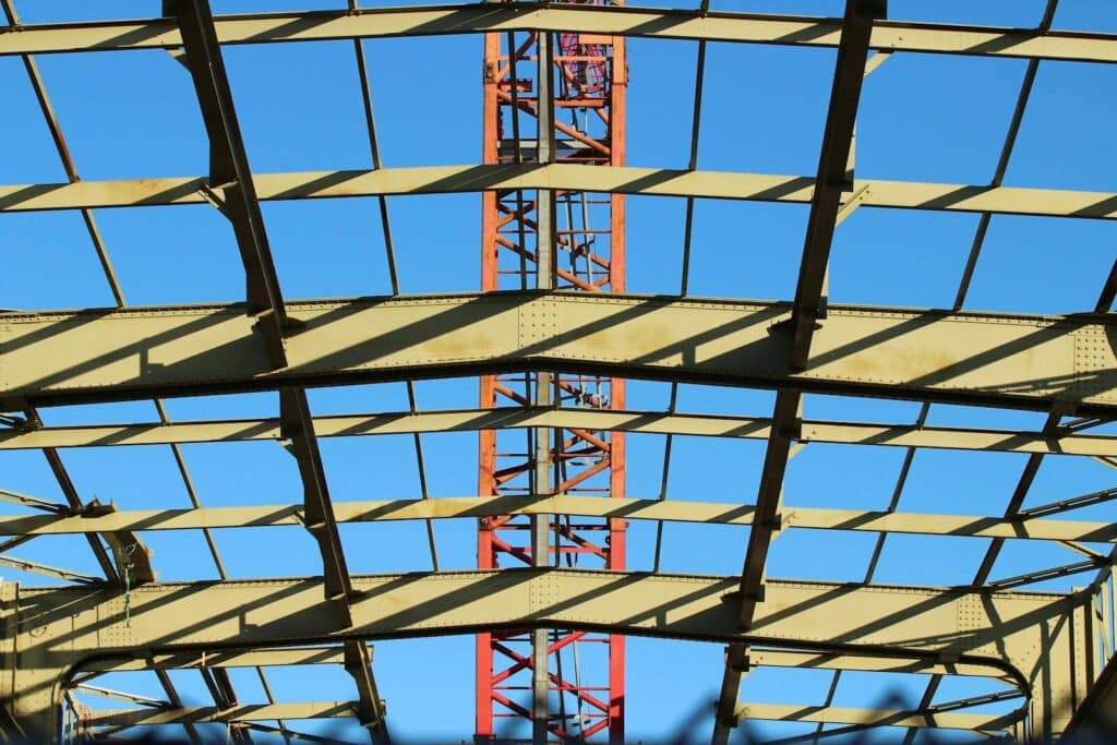 View of a steel construction framework under clear blue sky in the Netherlands.