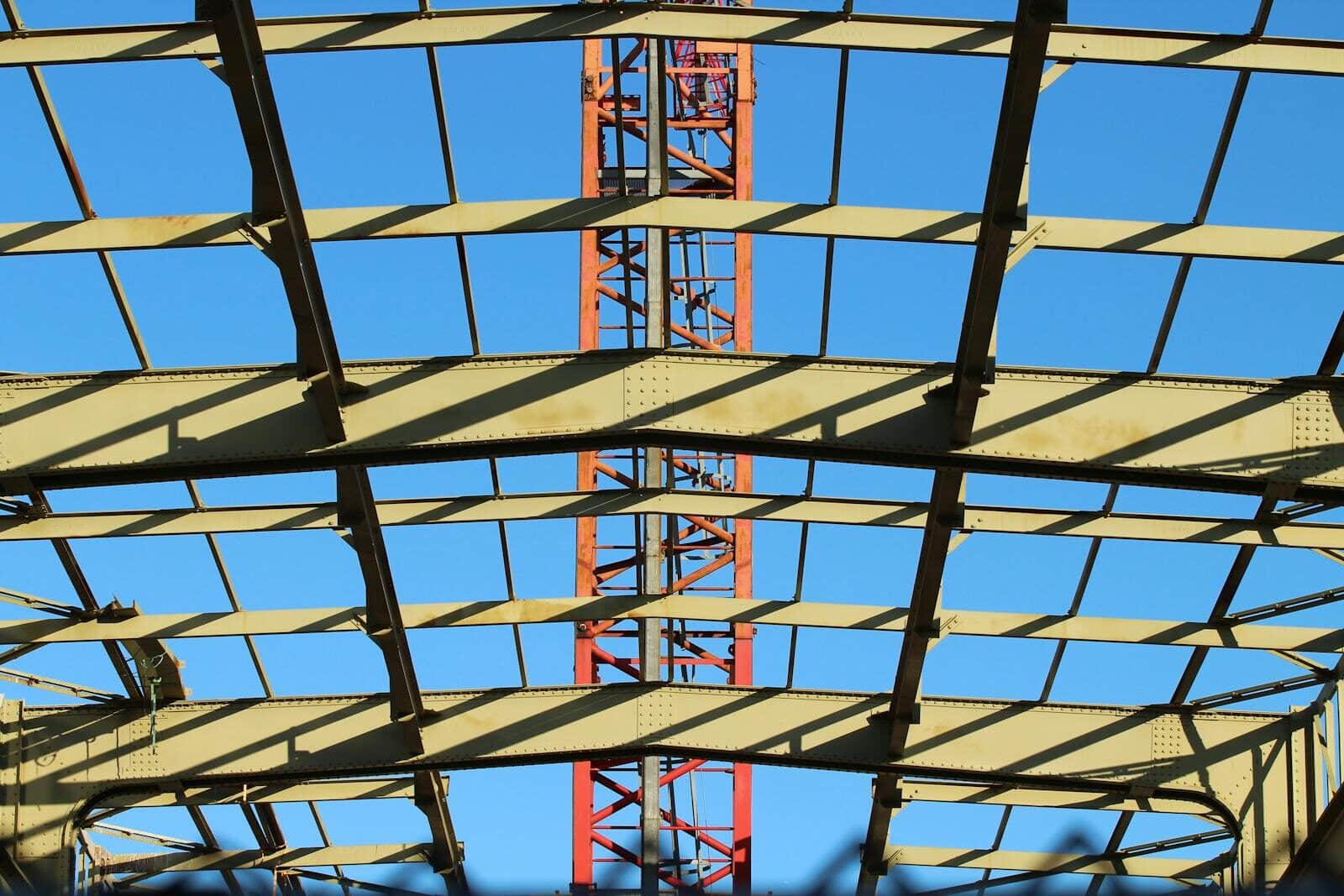 View of a steel construction framework under clear blue sky in the Netherlands.