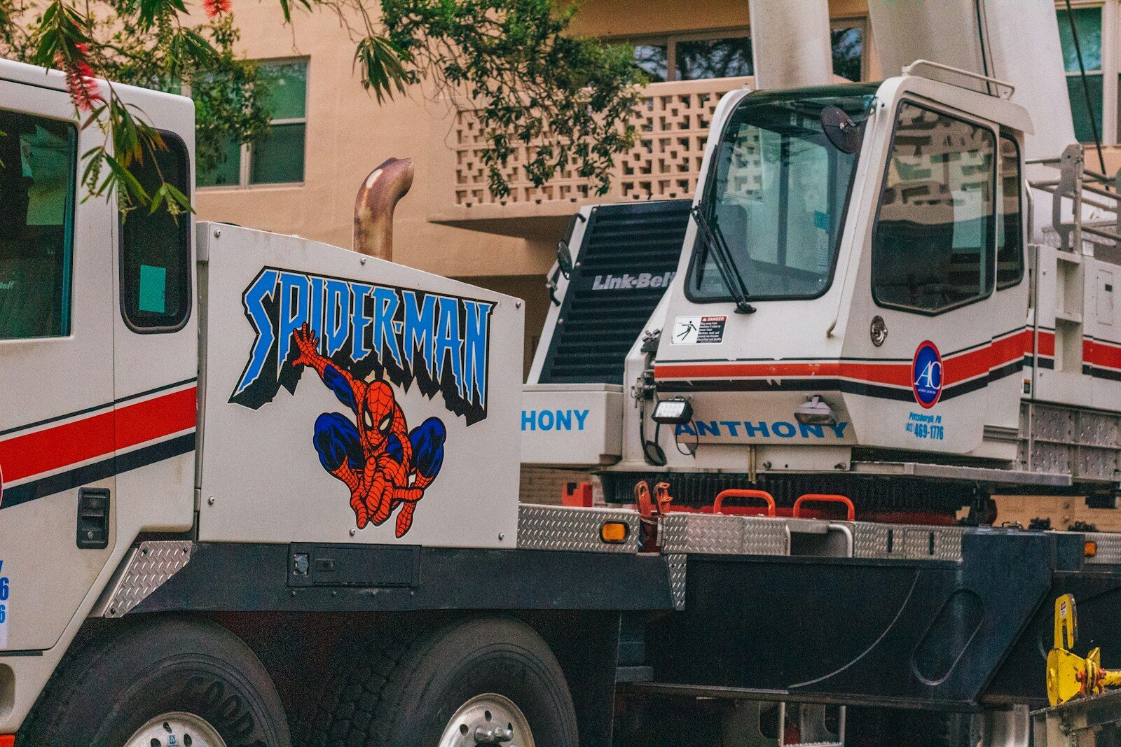 a tow truck is parked in front of a building