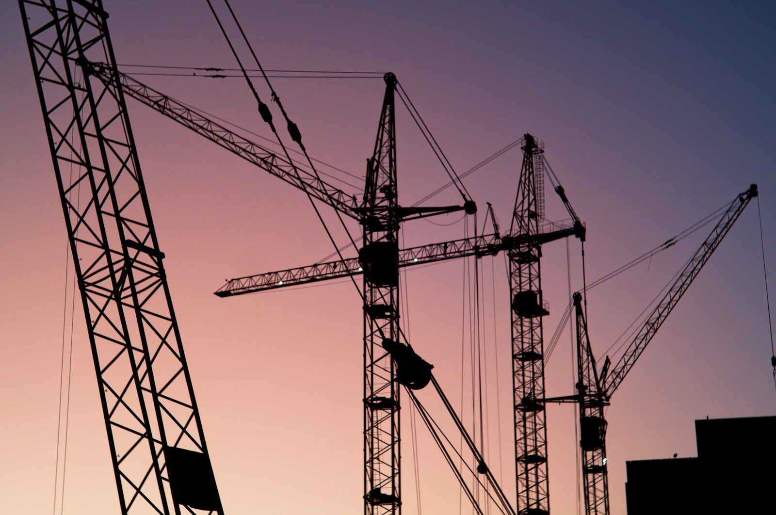 several tower cranes Design Build Construction for Occupied Renovations: What to Know