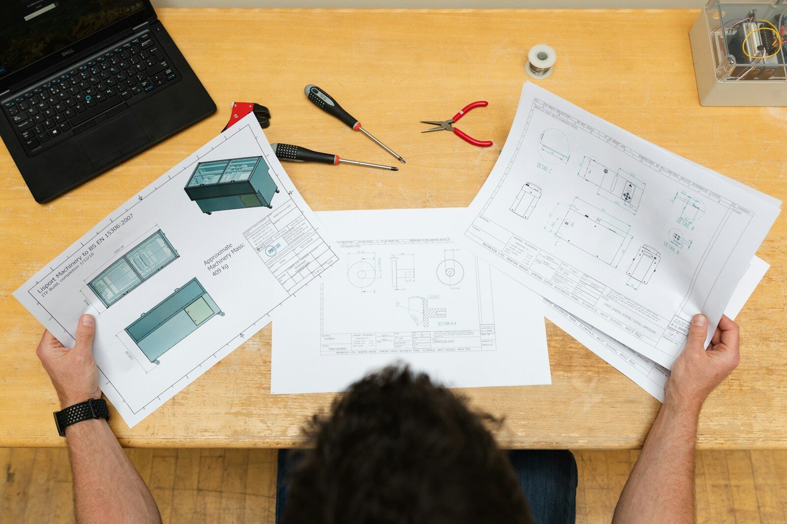 black and red click pen on white printer paper Design Engineer Vs. Architect: What Commercial Property Owners Should Know