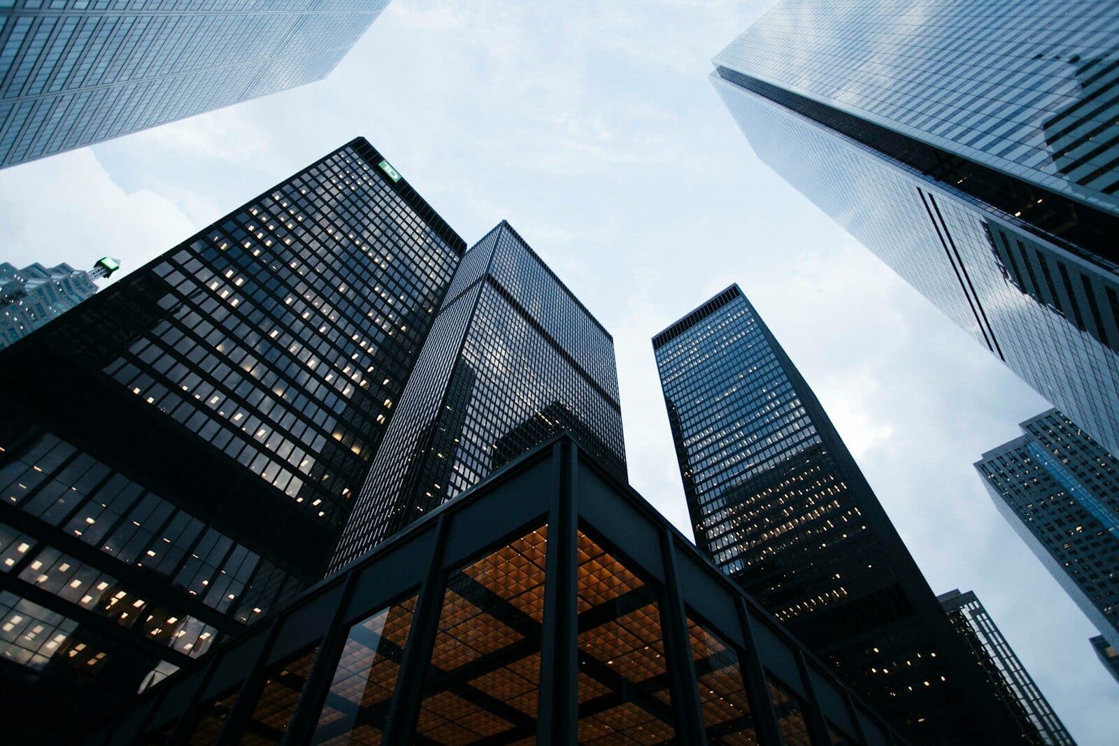 low angle photo of city high rise buildings during daytime How Commercial Building Construction Projects Are Planned And Managed